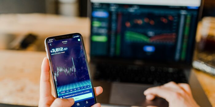 crypto trading on mobilephone and laptop